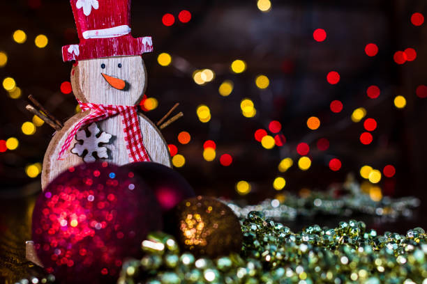 istock Decorations and ornaments in a colorful Christmas composition isolated on background of blurred lights. 1290862259