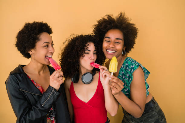 istock Multi-ethnic group of friends enjoying summertime while eating ice cream. 1290867229