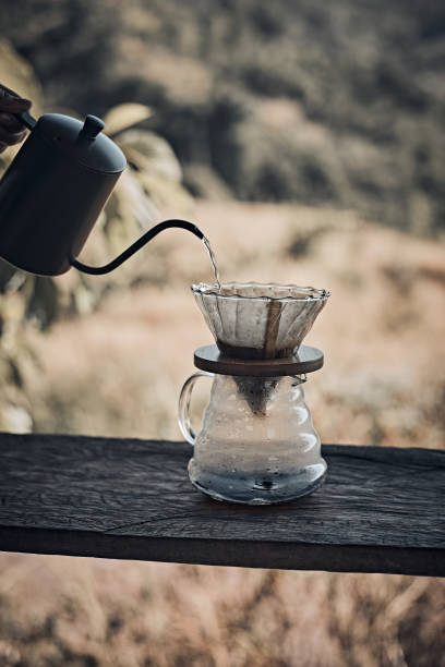 istock Hand drip coffee, Barista pouring water 1290868043