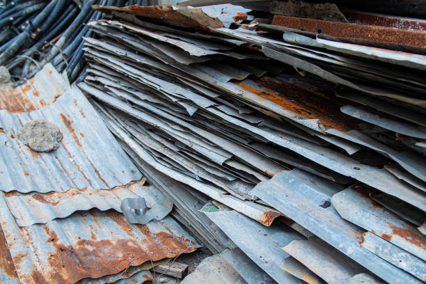 istock Old Corrugated Galvanized Sheet Metal Sheets in construction site. 1290869693