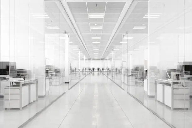 Corridor of a modern office with glass walls.