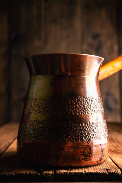 istock Freshly making coffee in vintage cezve. Selective focus. Shallow depth of field. 1290872002