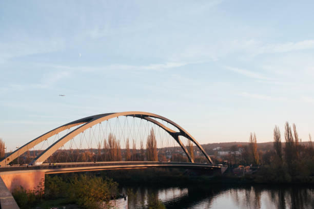 istock Bridge iron, blue sky and a plane in the background. 1290874102