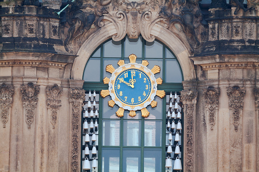 Clock with blue face at Zwinger Dresden. Zwinger was made by architect Matthäus Daniel Pöppelmann and sculptor Balthasar Permoser in 1728