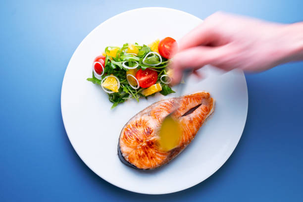 istock Grilled salmon with orange sauce 1290877418