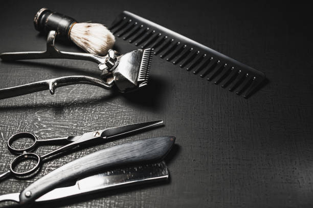 istock On a black surface are vintage manual barber tools. 1290879098