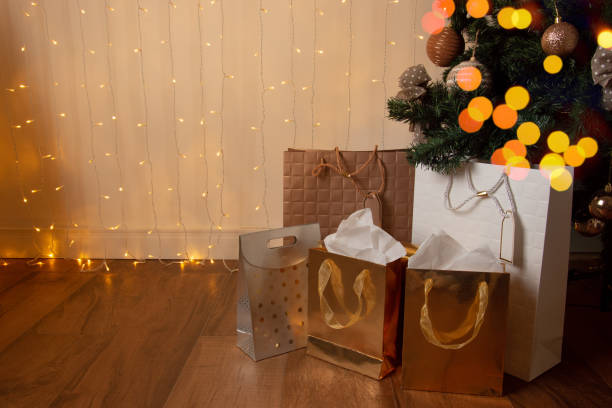 istock christmas gifts on the lit tree 1290879213