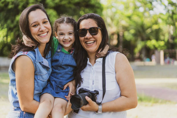 Portrait of family in the public park Brazil, Women, Photographer, Profession, Portrait pics of the godmother stock pictures, royalty-free photos & images