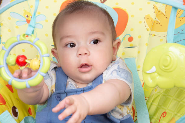 istock baby playing with colorful items 1290880617