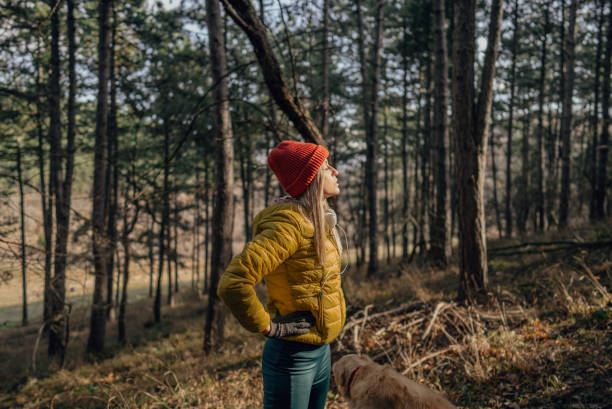 istock Young woman exercising with her dog 1290881524