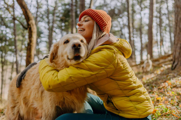 istock Young woman exercising with her dog 1290881570