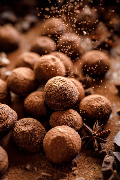 istock Homemade chocolate truffles with aromatic spices top view. 1290883082