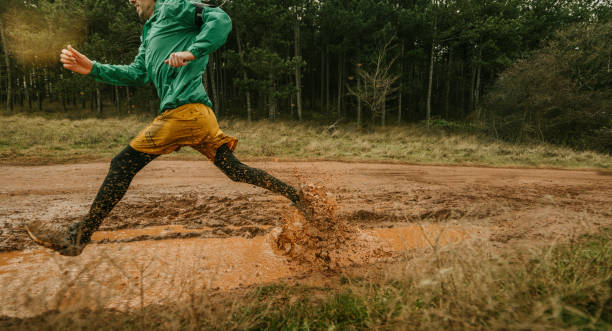 istock Young man exercising on extreme terrain 1290884419