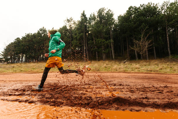 istock Young man exercising on extreme terrain 1290884421