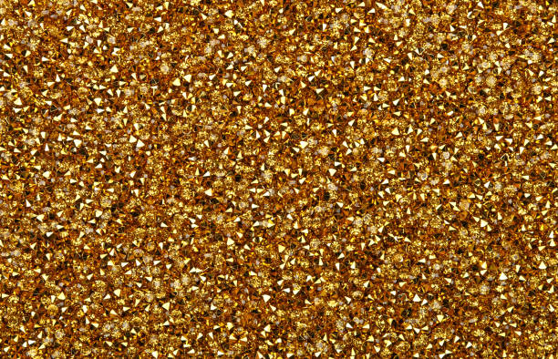 Abstract background of golden rhinestones Abstract background of colorful bright golden rhinestone strass crystals, elevated top view, directly above rhinestone stock pictures, royalty-free photos & images