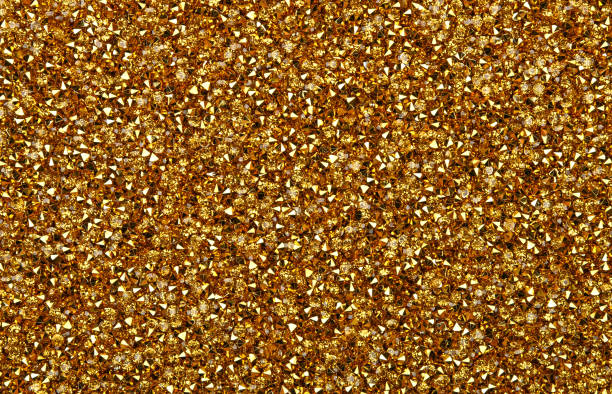 Abstract background of golden rhinestones Abstract background of colorful bright golden rhinestone strass crystals, elevated top view, directly above bronze glitter stock pictures, royalty-free photos & images