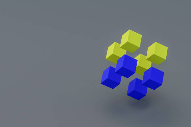 istock Yellow and blue cubes on gray background. Copy space for text. Block chain concept. 3d rendering 1290886457