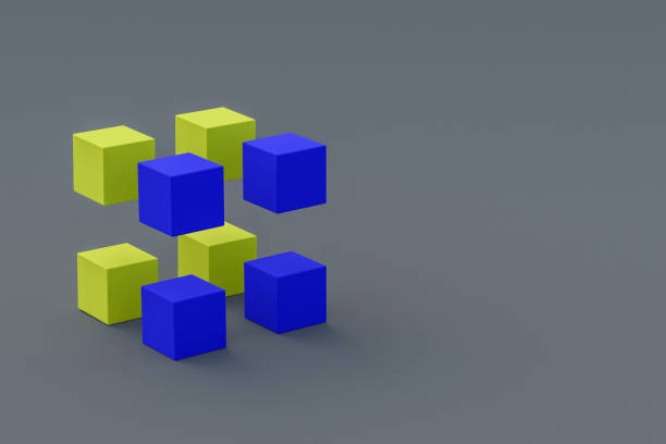 istock Yellow and blue cubes on gray background. Copy space for text. Block chain concept. 3d rendering 1290886520