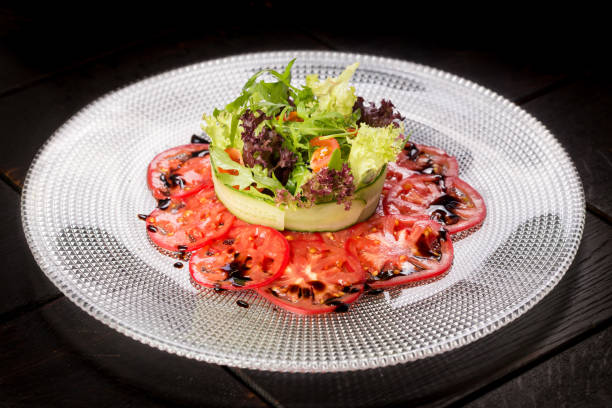istock Salad with crab and avocado on tomato carpaccio 1290887155