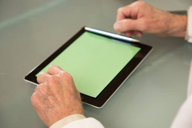 istock Medical Doctor uses chroma key tablet. 1290889826