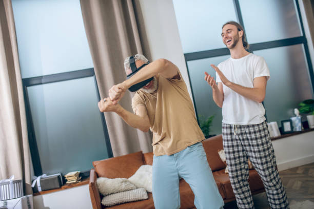 istock Mature man in vr glasses playing and feeling great 1290891946