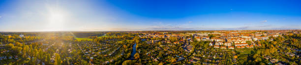 Autumn aerial view over the White Elster river alongside the Kleingartenpark am Rosental. Prominent in the image are some garden communities that are popular in Leipzig and similar to allotment gardens in the UK.