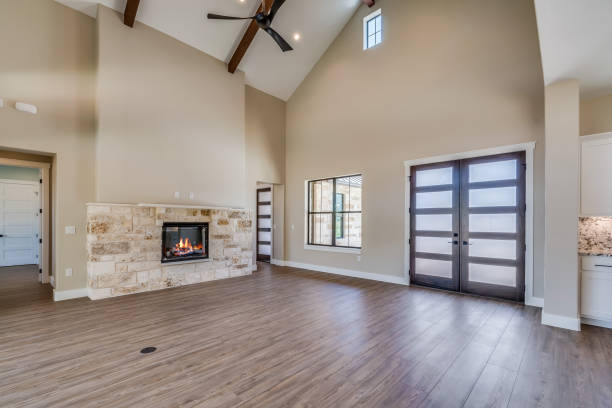 istock Great room with high vaulted ceilings with wood beams and ceiling fan 1290895885
