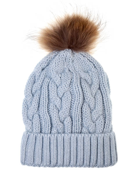 istock Knitted winter bobble hat with cable knitting ornament isolated on white 1290897995