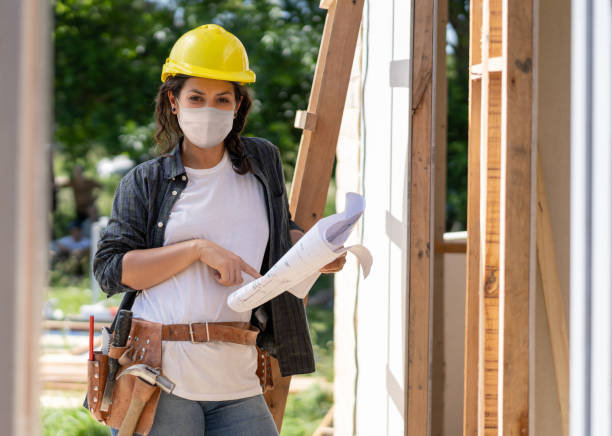 istock Contractor wearing a facemask while working at a construction site during the pandemic 1290900645