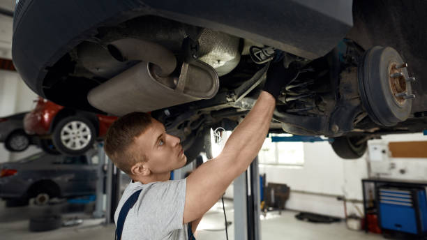 istock Caucasian repairman working with machine at car service station 1290904185
