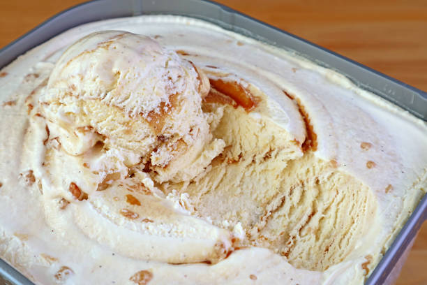 Closeup Mouthwatering Texture of Salted Caramel Macadamia Nut Ice Cream Closeup Mouthwatering Texture of Salted Caramel Macadamia Nut Ice Cream Pint of Ice Cream stock pictures, royalty-free photos & images