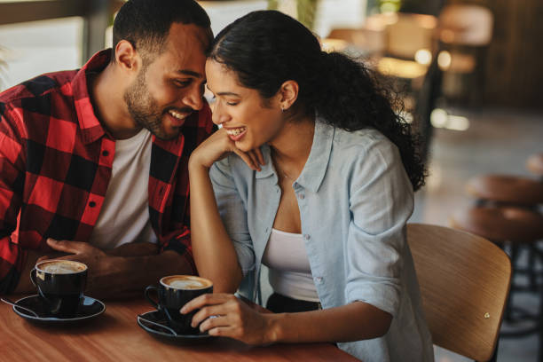 istock Beautiful couple on a date at cafe 1290905440