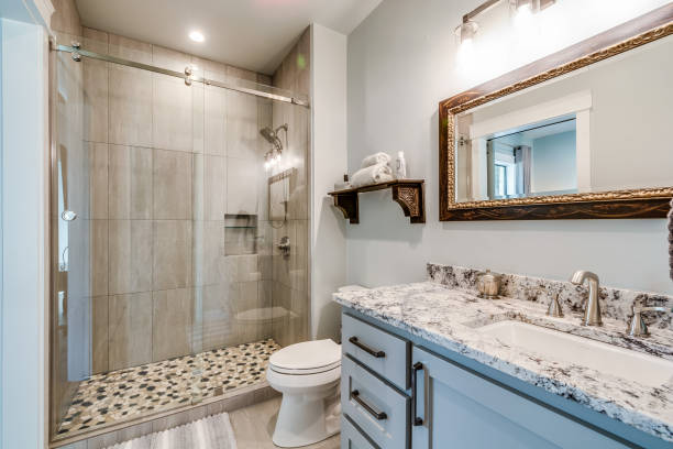 istock Tile floor in shower with sliding glass doors 1290907312