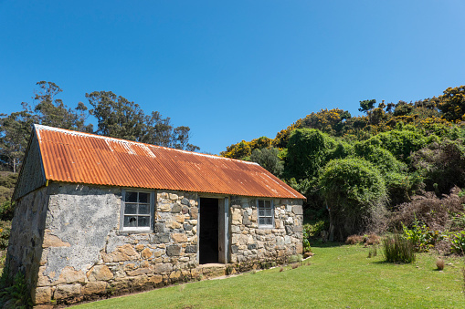 Old stone building with corrugated iron roof