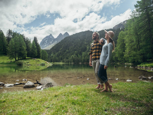 istock Couple relax by the lake in Summer 1290908641