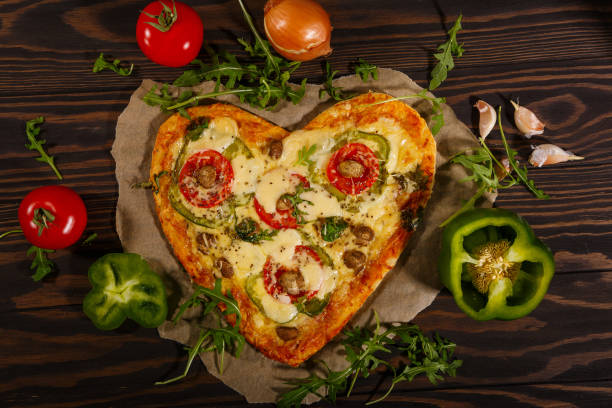 istock Pizza in the shape of a heart 1290910603
