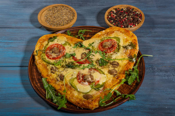 istock Pizza in the shape of a heart for two 1290910625