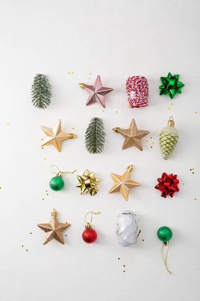 istock Overhead view of Christmas decorations on white surface 1290910720