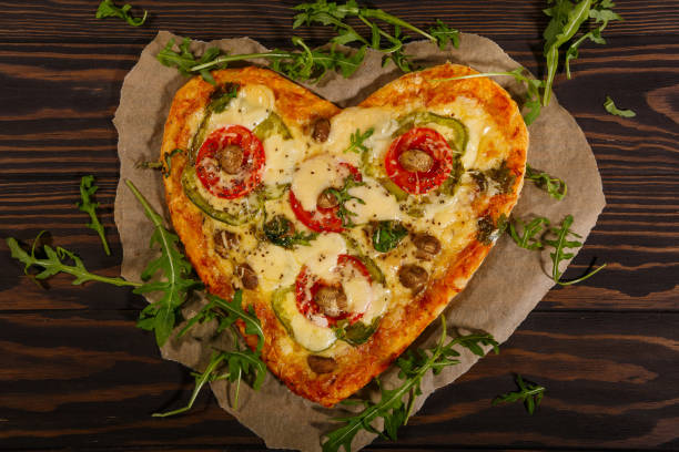 istock Pizza in the shape of a heart 1290910723