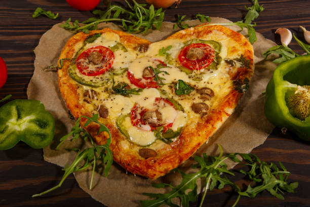 istock Pizza in the shape of a heart 1290910734