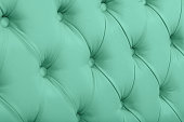 Teal leather capitone background texture