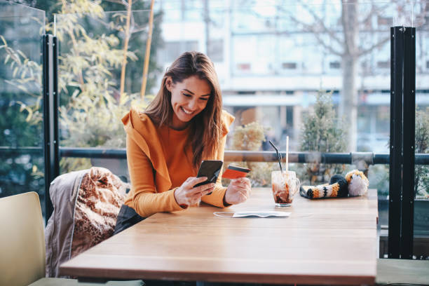 istock Young girl buying online, using her mobile phone. Corona virus awareness. 1290913794