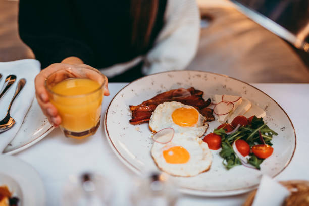 istock Young woman having breakfast at bedroom 1290915097