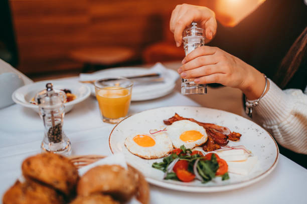 istock Young woman having breakfast at bedroom 1290915116