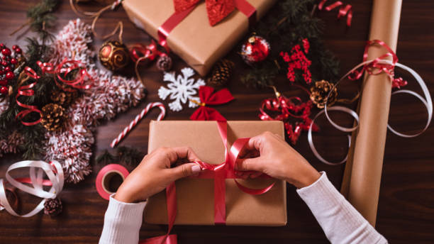 istock Wrapping Christmas gifts 1290915134