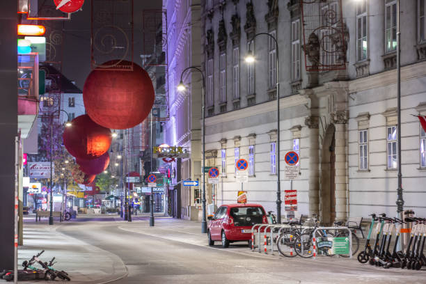 Empty streets in Vienna's popular 1st district during lockdown. The government asks people to stay at home between 20.00 and 06.00 therefore the usually busy areas are quiet. city street consumerism window display vienna stock pictures, royalty-free photos & images