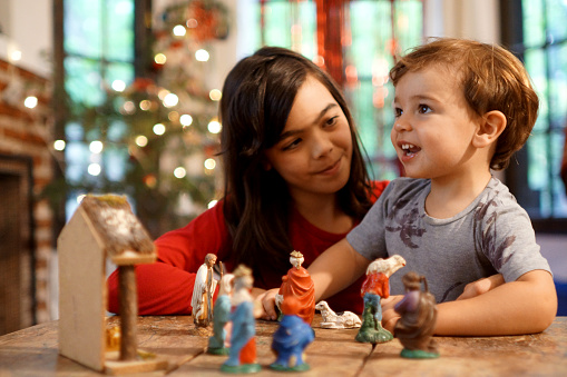 nativity scene with christmas tree background