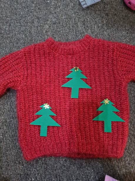 istock Home decorated Christmas jumper 1290919103