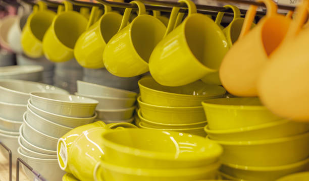 istock Multicolored cups hang on mall shelves 1290919998