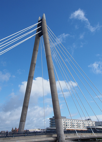 Southport, Merseyside , United Kingdom - 9 september 2020: the concrete tower and cables of the suspension bridge in southport merseyside against a blue sky